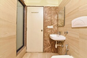 A bathroom with a toilet, sink, and shower. - FabHotel Harsh Paradise - Malviya Nagar (Jaipur)