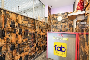 A reception desk with a sign for 'M.R. Reception' and 'fab HOTELS'. - FabHotel MR Guest Line - Banashankari (Bangalore)