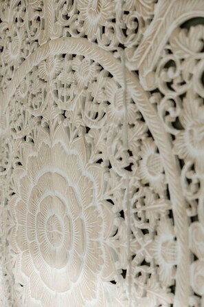 A close-up of a detailed carved architectural design. - Luxury Glamping Dome with Fire Pit and Open Field Views in Ontario, Canada (Marmora)