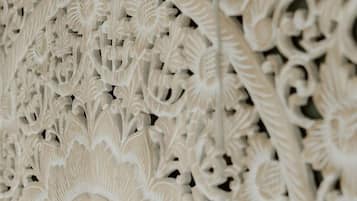 A close-up of a detailed carved architectural design.