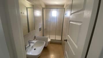 Family Quadruple Room | Bathroom | Combined shower/tub, free toiletries, slippers, towels