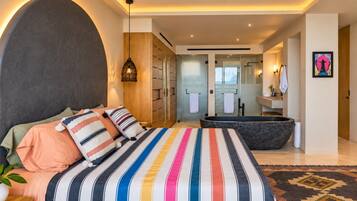 Warm lighting, colorful textiles, and a king bed create an inviting spot to settle in after a day exploring.