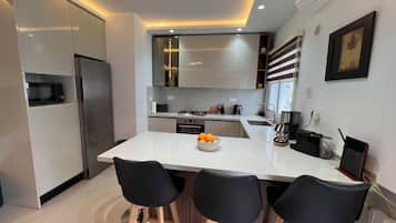 Bloc d'apartaments estàndard | Cuina privada | Placa de cuina