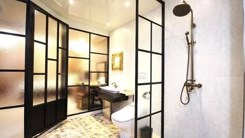 Separate tub and shower, hair dryer, slippers, towels
