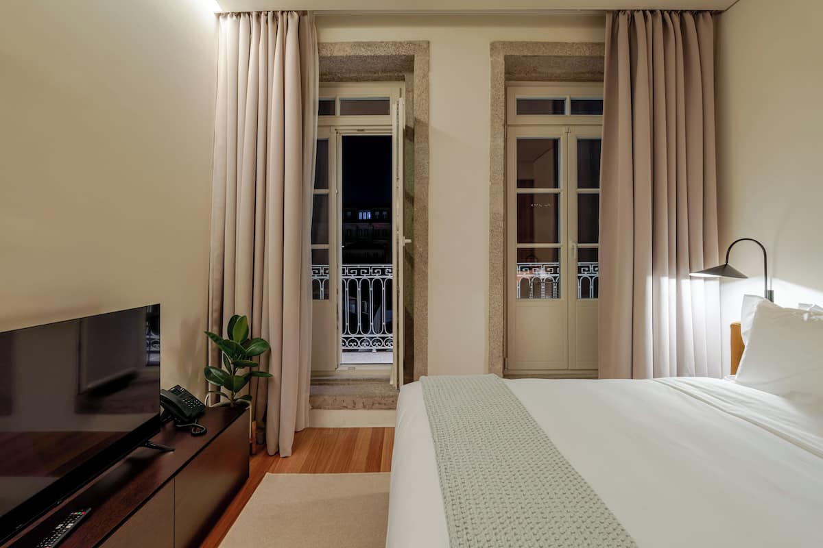 Cozy Double Room | Minibar, in-room safe, blackout drapes, iron/ironing board (on request)