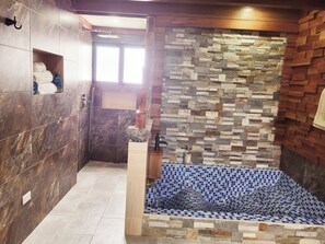 Shower, towels, soap, toilet paper