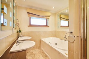Shower, hair dryer, towels, shampoo