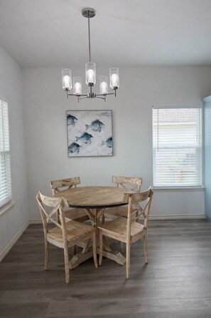 Dining - The Sol & Mar Retreat, two neighboring homes in Aransas Pass perfect for large groups! Enjoy 6 bedrooms, 4 baths, 2 king beds, 8 queen beds, spacious yards, covered outdoor areas, and boat parking near beaches, fishing, and coastal attractions. (Aransas Pass)