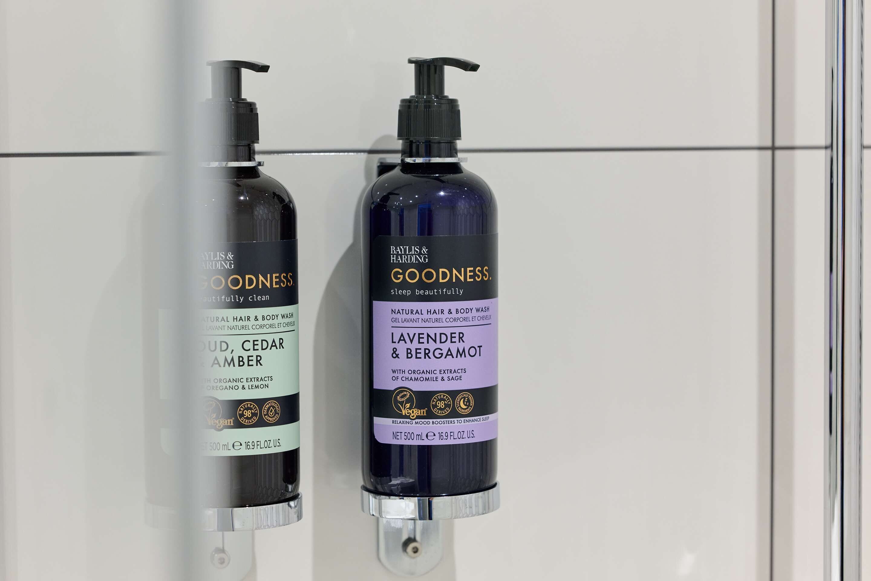 Two bottles of Baylis & Harding Goodness body wash.