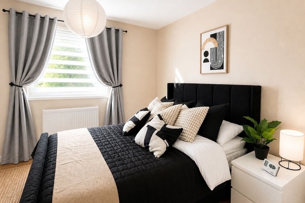 Bedroom one features a comfortable double bed with fresh linen and towels provided.