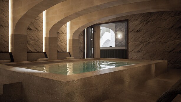 A spa area with a pool, stone walls, and arched ceilings. - Casa Azure Member Of Meliá Collection (San Lawrenz)