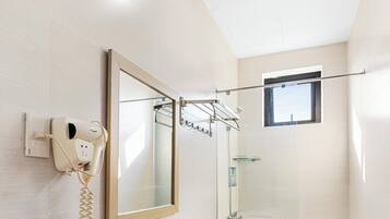 Shower, hair dryer, towels, soap