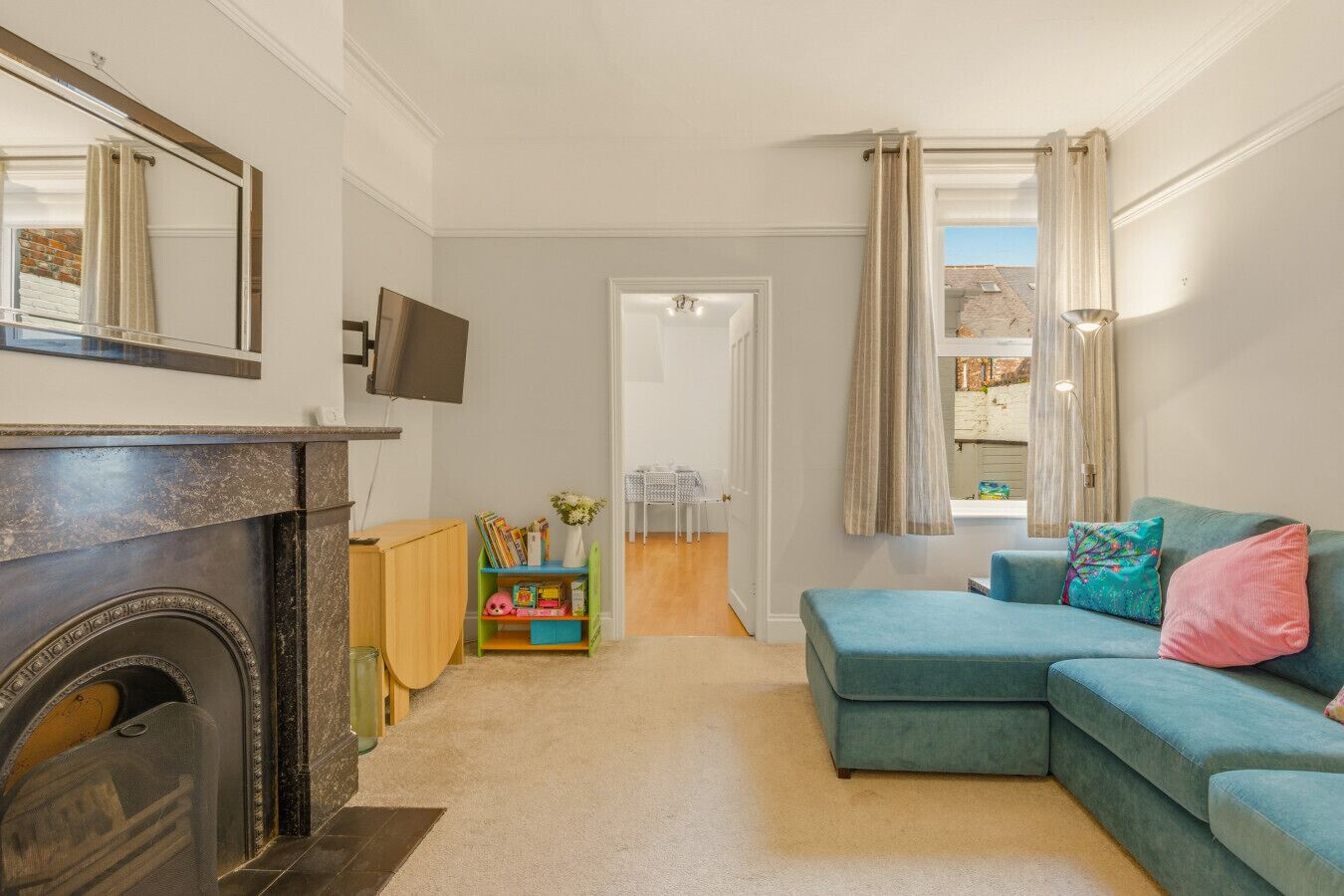 TV, fireplace, books