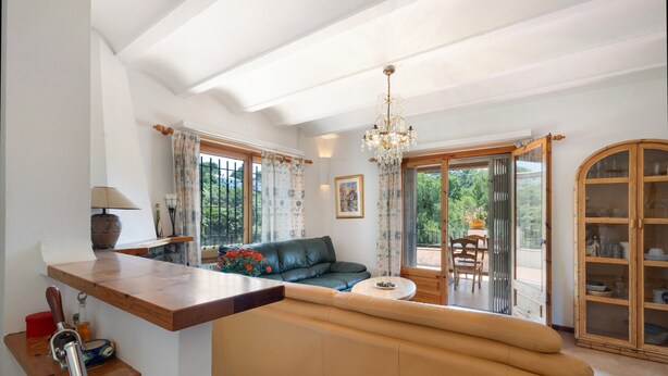 A modern kitchen with a wooden countertop, a built-in oven, and a sink. - House with Spacious Terrace and Private Barbecue (Begur)