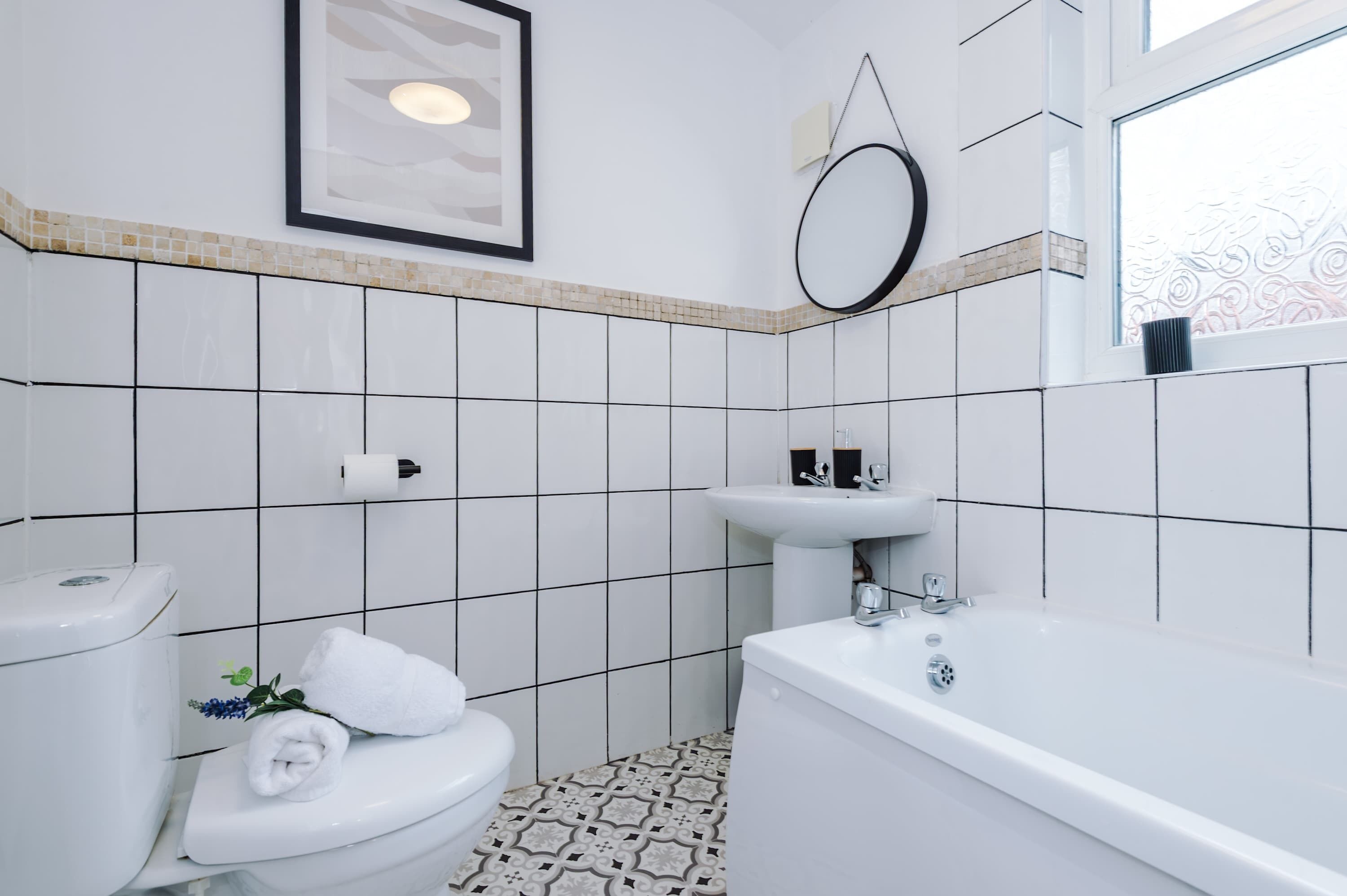 Shower, hair dryer, towels, shampoo
