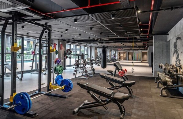 A gym with weightlifting equipment, benches, and cardio machines. - Bomonti Suites (Istanbul)