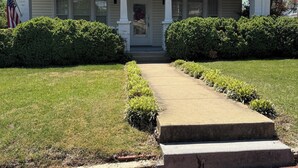 A two-story house with a front porch, number 109, and a brick pathway leading to the entrance. - Spacious 5-bedroom house in serene Fincastle with AC (Fincastle)