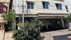 A multi-story building with a flat facade, multiple windows, and a visible entrance. - The Soft Light Studio (Hyderabad)