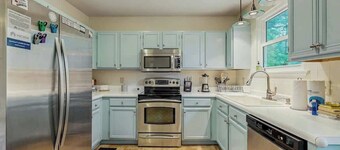 Cozy custom-furnished home with yard, firepit, children's items, AC, & office