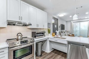 Fridge, microwave, oven, stovetop - Muse | Centrally-located condo with fast WiFi, central AC, balcony & gym (Nashville)