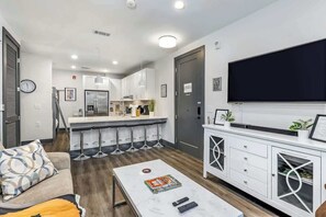 TV, offices - Muse | Centrally-located condo with fast WiFi, central AC, balcony & gym (Nashville)