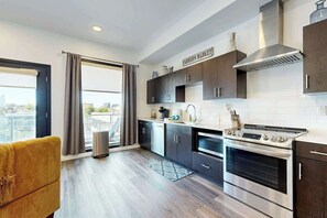 Fridge, microwave, oven, stovetop - Luxe Top Floor Condo with Balcony, W/D, Seasonal Courtyard Pool, & Gym (Nashville)