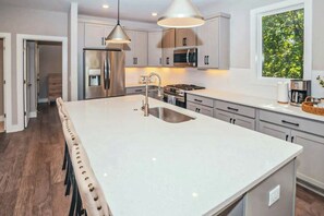 Fridge, microwave, oven, stovetop - Brand-new townhome - Monty - two-car garage, private W/D, and rooftop deck (Nashville)