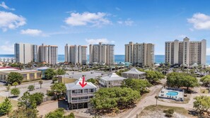 A coastal hotel area with high-rise buildings, a pool, and a beach view. - 🏖️ Romar Village 621 | 2BR Orange Beach Condo | Near Beach + Sleeps 4 (Orange Beach)