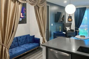 TV, offices - Muse | Rockstar downtown condo with private balcony, central AC & gym (Nashville)