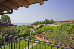 Apartment, Balcony | Property grounds - Montecolo Resort E7 by Wonderful Italy (Manerba del Garda)