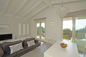 Apartment, Balcony | Living area - Montecolo Resort E7 by Wonderful Italy (Manerba del Garda)
