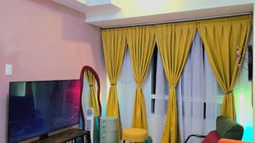 Deluxe Condo, City View | Living area