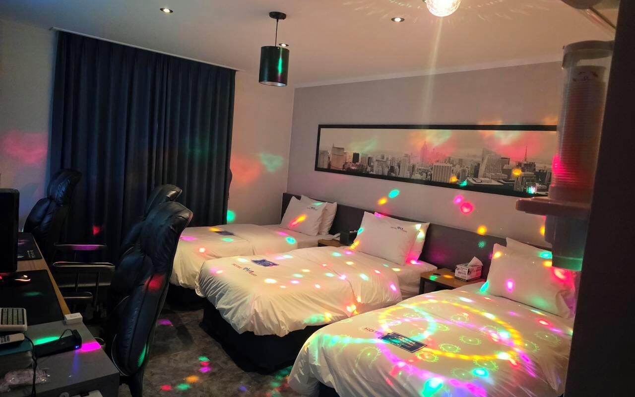 Deluxe Triple Room, Park View | Desk, laptop workspace, blackout drapes, free WiFi