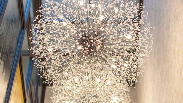 A chandelier with multiple light bulbs hanging from a central point. - The Kylestrome Deluxe - King or Twin (Ayr)