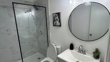 Shower, towels, soap, toilet paper