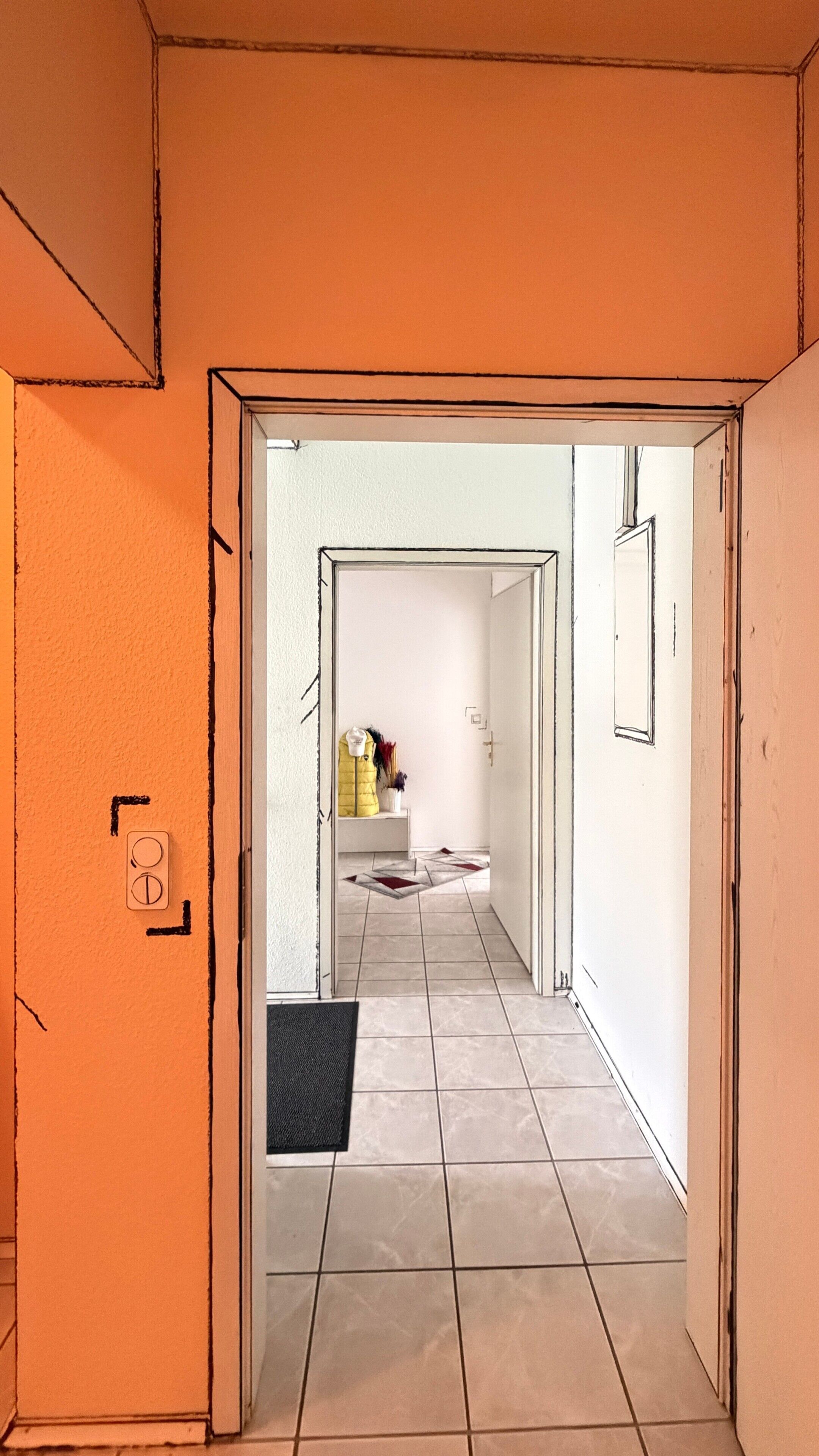 A hallway with a tiled floor leading to a room with a bed and a nightstand.
