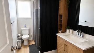 Shower, hair dryer, towels, soap