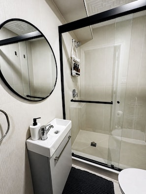 Shower, hair dryer, towels, soap