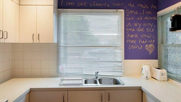 A kitchen with a window, a sink, and a toaster. - Peace and Love 2 BDR Townhouse West Melbourne (West Melbourne)