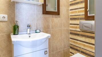 Superior Triple Room, City View | Bathroom | Hair dryer, slippers, towels, soap