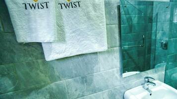 Comfort Room, Balcony, City View | Bathroom | Towels, soap, shampoo, toilet paper