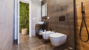 A modern bathroom with a glass-enclosed shower, a white sink, and a large mirror. - EDEN LUXURY ROOMS & GARDEN (Modugno)