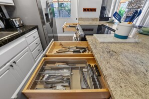 A kitchen with a drawer organizer containing various utensils. - Heated Pool & Hot Tub | Old Town | Sleeps 10+ (Scottsdale)