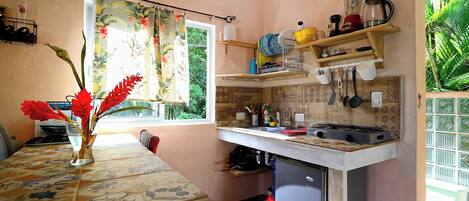 A kitchen with a window, a countertop, and a sink.