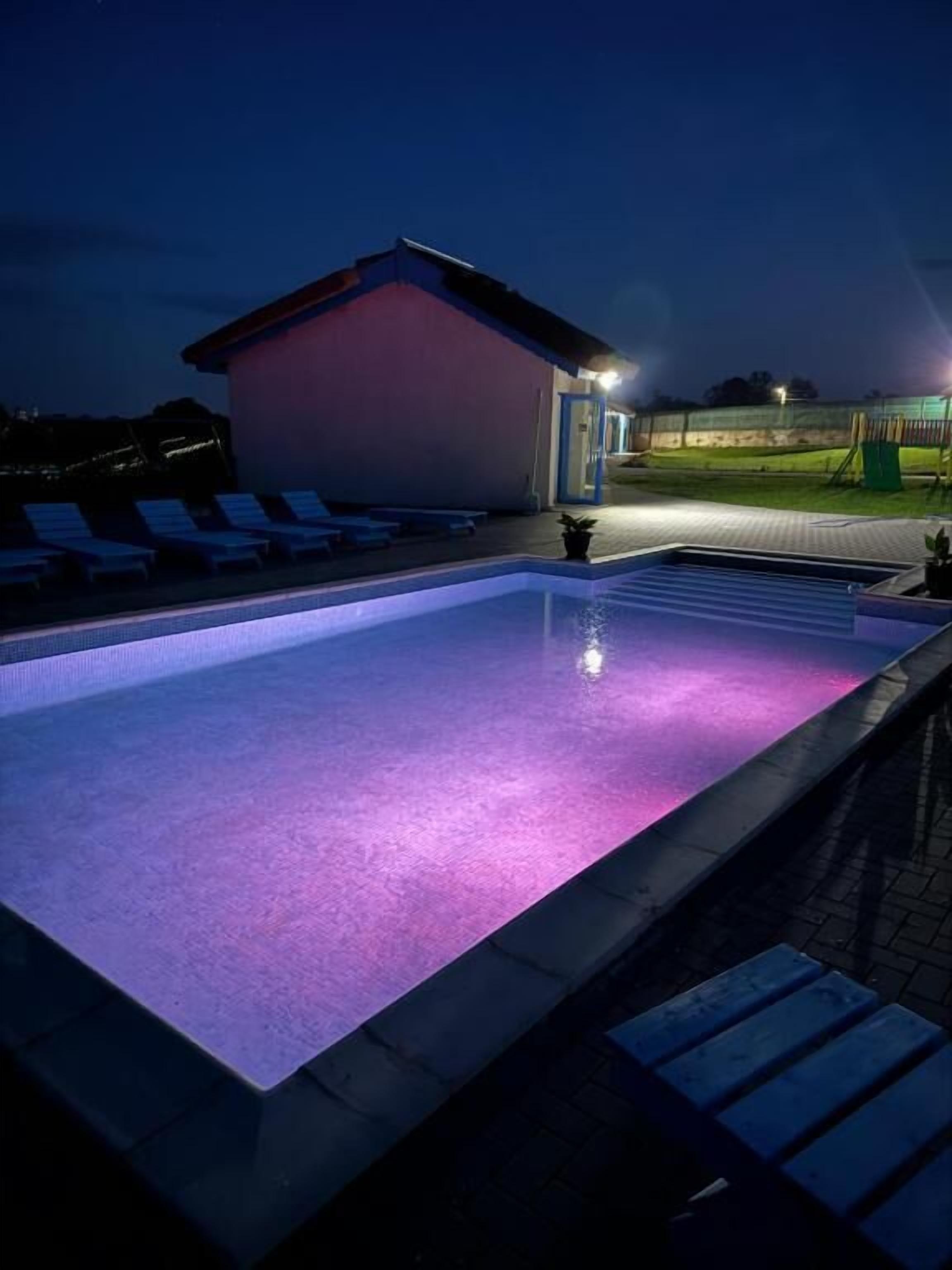 Seasonal outdoor pool, open 8:00 AM to 8:00 PM, pool umbrellas