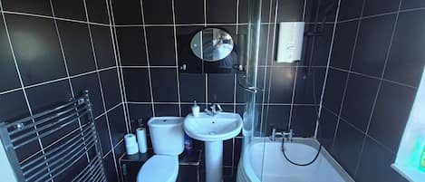 Separate tub and shower, deep soaking tub, towels