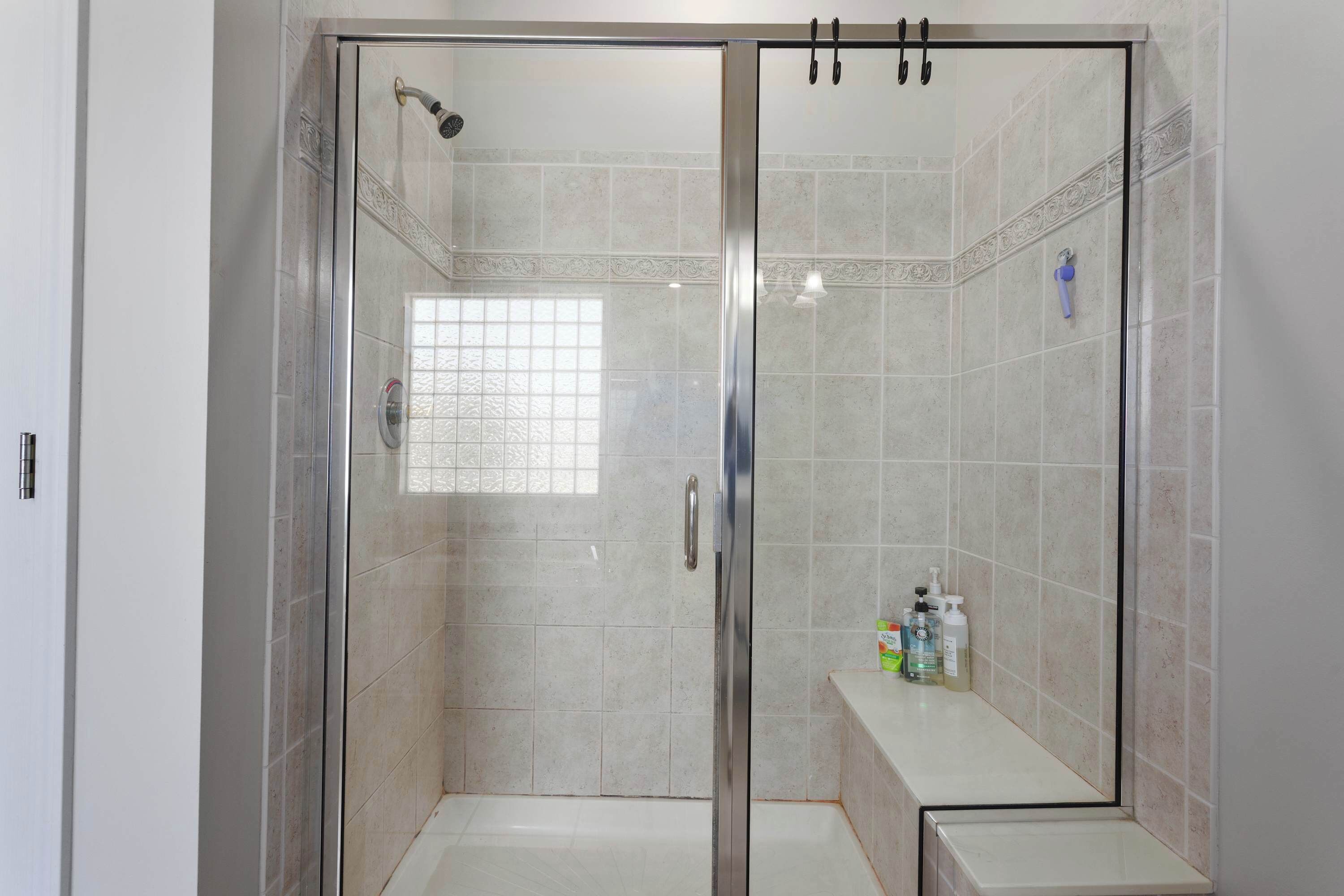 Shower, hair dryer, towels, shampoo
