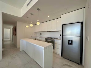 Fridge, microwave, oven, stovetop - Walk to Medano Beach & Marina Modern 3BR Condo (Cabo San Lucas)