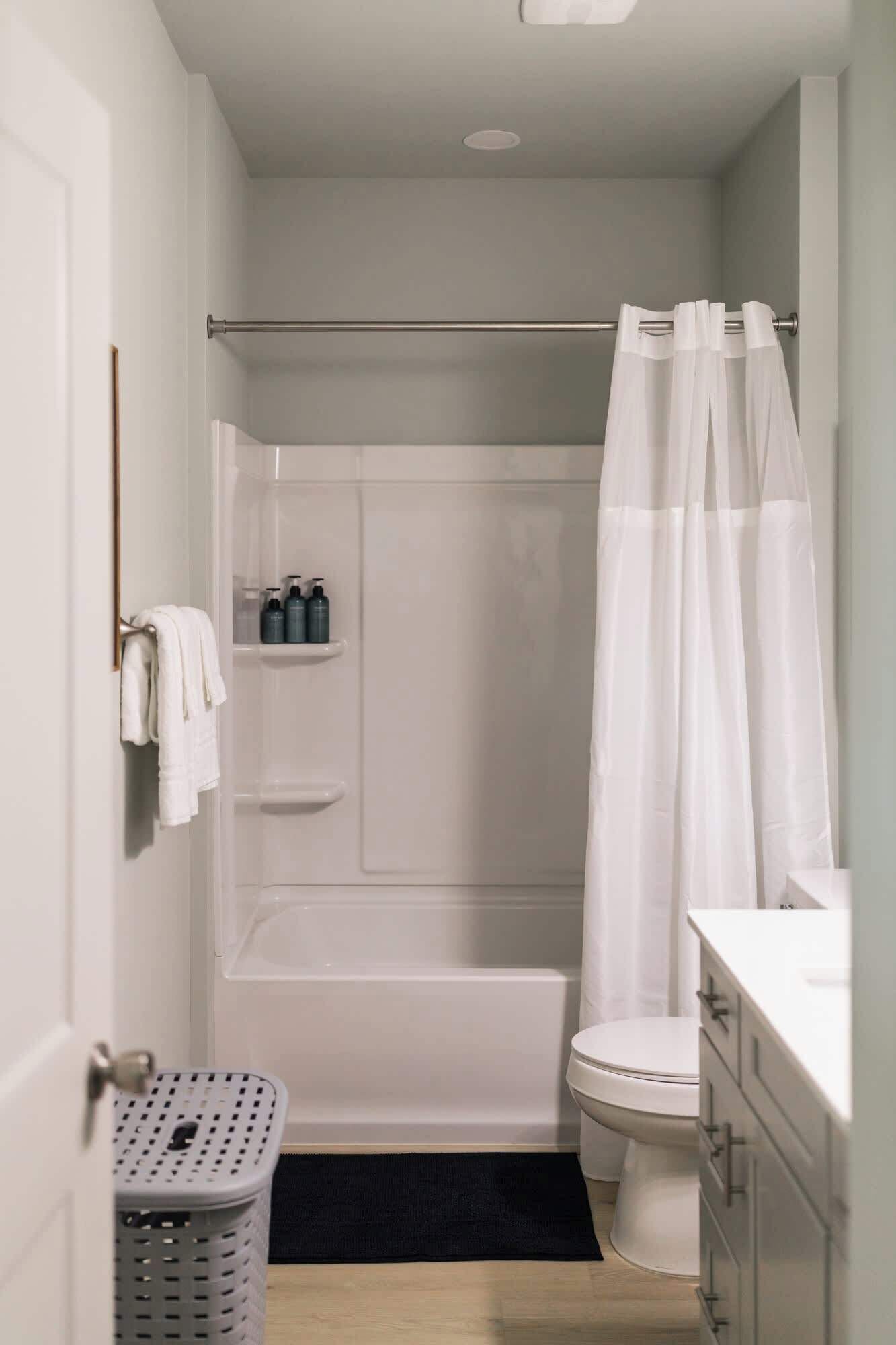 Shower, hair dryer, towels, shampoo