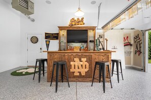 A bar area with stools, a dartboard, and a sign reading 'Notre Dame Classic of 2023.' - The Experience at ND<>4BR, 4BA <1 mi to ND Stadium (South Bend)